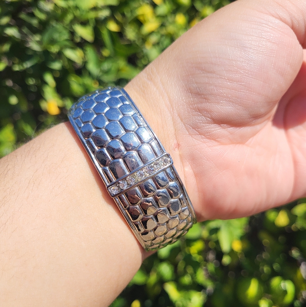 vintage silver-tone clamper cuff bangle with a pebbled texture and rhinestone